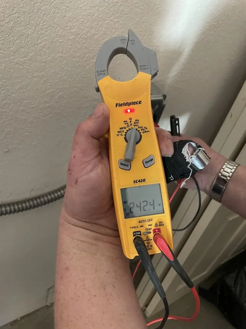 Voltage testing with clamp meter during Electrical Installation Services in Lake View